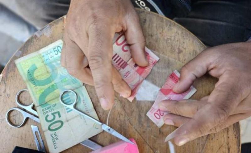 شرطة غزة تحذر التجار من رفض العملات الصالحة للتداول